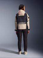 Alpinestars Molly Air Jacket, Women's Motorcycle Jacket, Black Almond, rear view showing the hood and large logo on the back, utility-inspired ripstop design, styled with black riding pants.