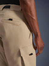 Alpinestars Flex-AST Cargo Pants, Light Beige, close-up of hip and side cargo pockets, featuring embroidered brand logo, black pull tabs, and military-inspired twill design for urban motorcycle riders