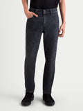 Alpinestars Flex-AST 7 Denim Hose, Herren-Motorradjeans in verblasstem Schwarz, getragen von einem Model mit technischem Denim und urbaner Schutzbekleidung