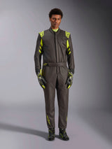 Alpinestars GP Race V3 Suit FIA, Auto Racing Suit, Black and Yellow Fluo, worn by a model with matching racing gloves and boots, featuring bright yellow accents on the shoulders, waist, and sleeves, professional motorsport gear