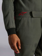 Alpinestars GP Race V3 Suit FIA, Auto Racing Suit, Anthracite Red, close-up of the adjustable waist belt featuring a red embroidered logo and black ribbed sleeve cuff on textured twill fabric
