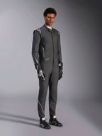 Alpinestars Hypertech V3 Suit, Auto Racing Suit, Black and Dark Shadow, worn by male model with matching black gloves and racing shoes, athletic slim fit, features Alpinestars logos and light gray accents, professional motorsport protective gear