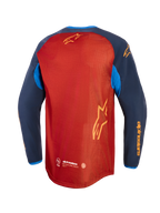 Alpinestars Maxdura Dual Jersey, Adventure-Motorradtrikot, Rostbraun und Mood Indigo mit leuchtend blauen Akzenten, Rückansicht mit vollständigem Mesh-Torso, verlängertem Rückensaum und gelbem Alpinestars-Branding auf den Ärmeln und dem Rücken