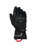 Alpinestars WT-8 GORE-TEX Isolierte Handschuhe, Motorradhandschuhe, Schwarz, Innenansicht der Handfläche zeigt verstärkte Lederbesätze und gepolsterte Slider, lange Stulpe mit einer roten Zugschlaufe und Alpinestars Exploration Equipment Branding mit geografischen Koordinaten, technisches Road- und Adventure-Design