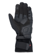 Alpinestars Tourer W-7 V2 Drystar® Handschuhe, schwarze Motorradhandschuhe, Handflächenansicht mit Lederverstärkungen, gepolsterten Griffbereichen, touchscreen-kompatibler Fingerspitze und sicherem Riemenverschluss am Handgelenk.