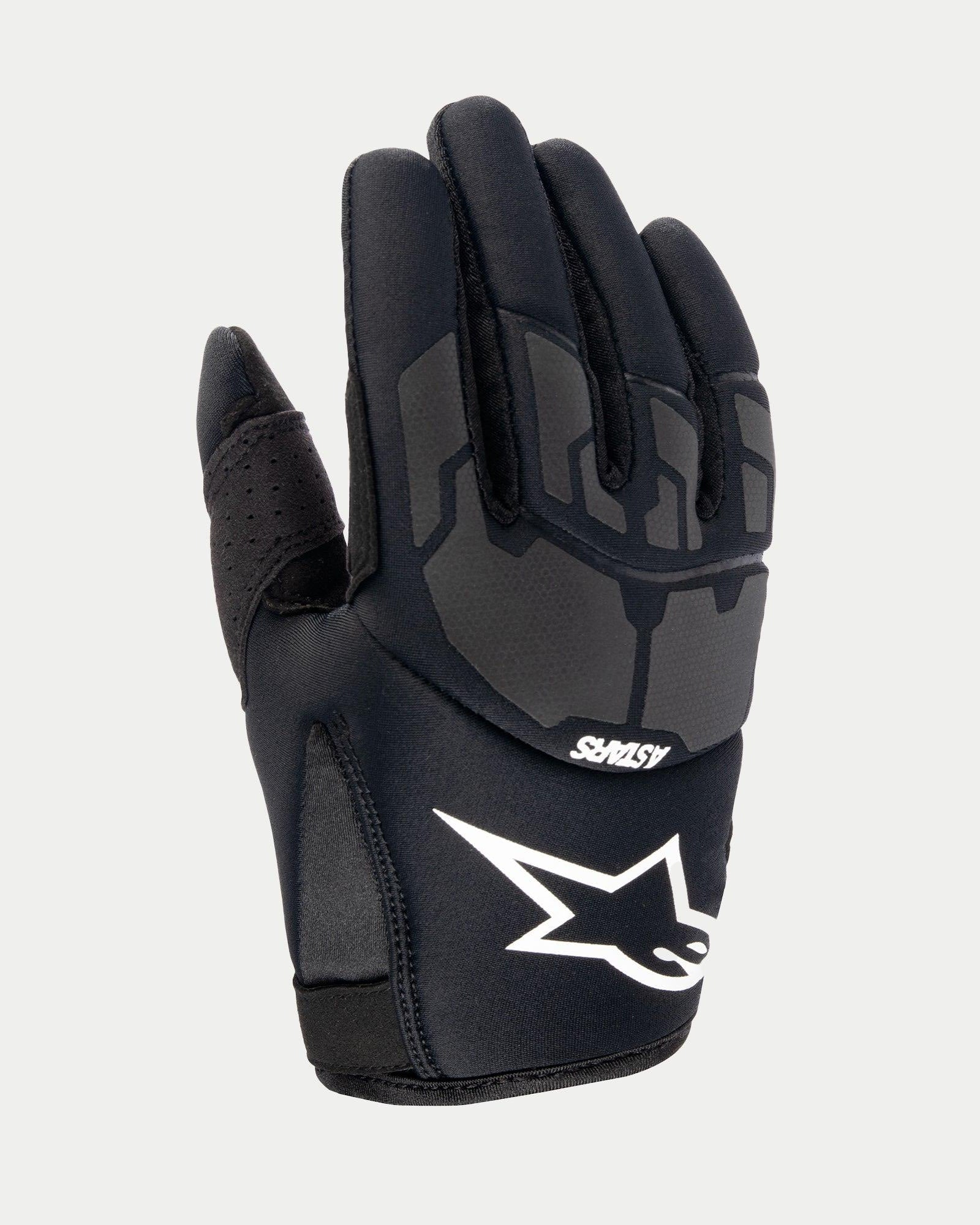 Alpinestars Jugend 2024 Thermo Shielder Handschuhe, schwarze Motocross-Handschuhe, Ansicht des Handrückens mit Neopren-Konstruktion, graue laserlaminierte Schutzmuster, weißes Alpinestars-Logo und ASTARS-Branding, isoliert für Offroad-Einsätze bei kühler Witterung