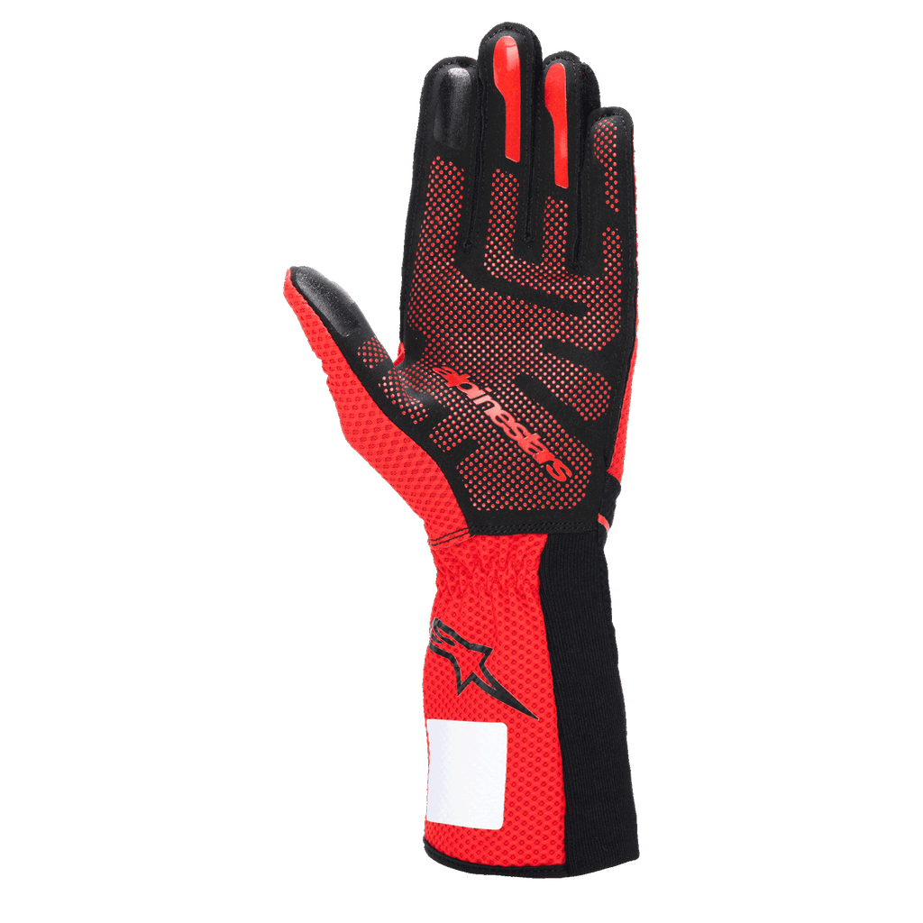 Alpinestars Tech-1 KX V4 Handschuhe, Karthandschuhe, Schwarz und Rot, Ansicht der Handfläche mit 3D-Silikon-Gripmuster, atmungsaktivem rotem Mesh-Gewebe und weißem Identifikationsetikett am Handgelenk