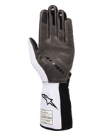 Alpinestars Tech-1 KX V4 Handschuhe, Kart-Handschuhe, Weiß, Schwarz und Gold, Innenhandansicht mit 3D-Silikon-Gripmuster, atmungsaktiver weißer Mesh-Konstruktion und FIA 8877-2022 Zertifizierungsetikett an der Manschette.