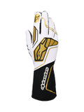 Alpinestars Tech-1 KX V4 Handschuhe, Karting-Rennhandschuhe, Weiß und Schwarz mit goldenen Akzenten, mit goldenem Stern-Logo auf dem Zeigefinger und großen geometrischen Mustern auf dem Handrücken, atmungsaktive Mesh-Konstruktion mit schwarzer Manschette und weißem Branding, ergonomisches Design für Motorsport-Performance