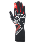 Alpinestars Tech-1 Race V4 Gloves, Auto Racing Gloves, Black with Red and White accents, featuring a large white star logo on the backhand, red finger gussets, white branding on the extended gauntlet cuff, and geometric design patterns.