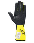 Alpinestars Tech-1 Race V4 Handschuhe, Auto-Rennsport-Handschuhe, Schwarz und Gelb Fluo, Innenhandansicht mit strukturierter Silikon-Grip-Fläche, verlängerte gelbe Stulpe mit FIA-Zertifizierungsetikett, Hochleistungs-Motorsportausrüstung