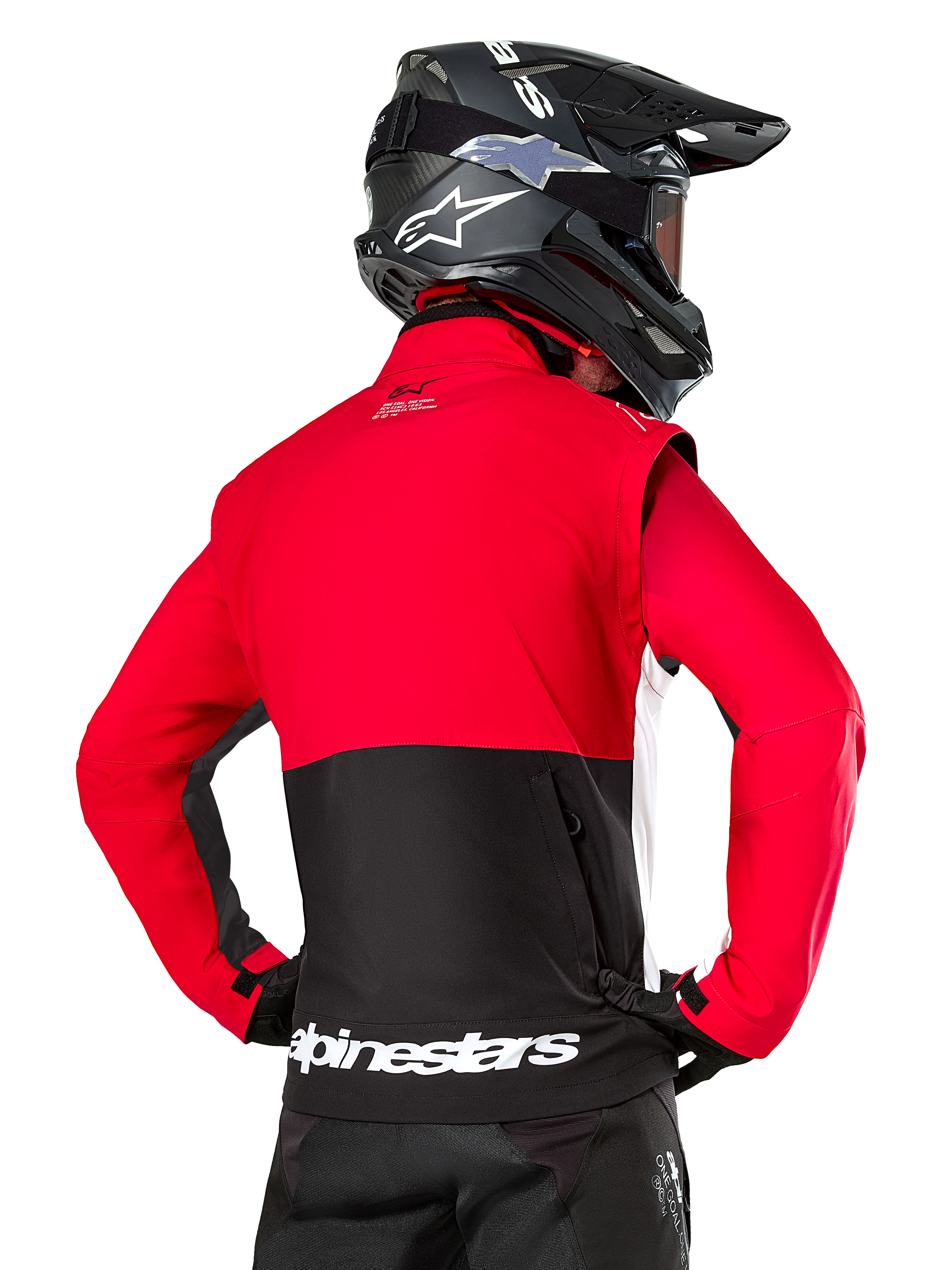 Alpinestars Pro-Dura Jacket, Off-Road Enduro Jacket, Red and Black with white Alpinestars logo on back hem, worn by rider from behind with a black motocross helmet, rally-inspired design for aggressive trail riding