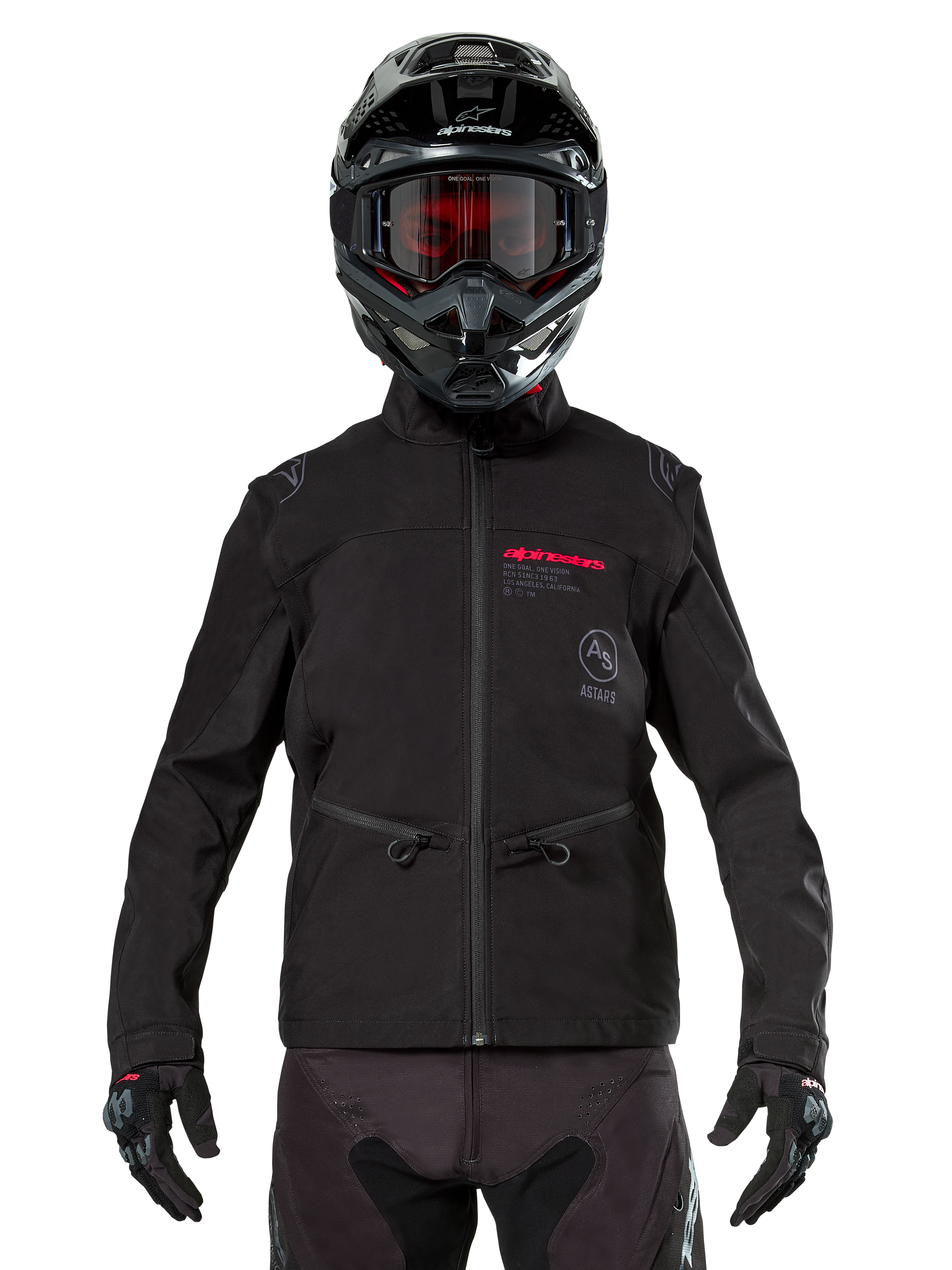 Motocross rider wearing Alpinestars Lite-Dura Softshell Jacket in Black, featuring red and grey logo details on the chest, black helmet with red-tinted goggles, black gloves and pants, front view of technical off-road riding apparel