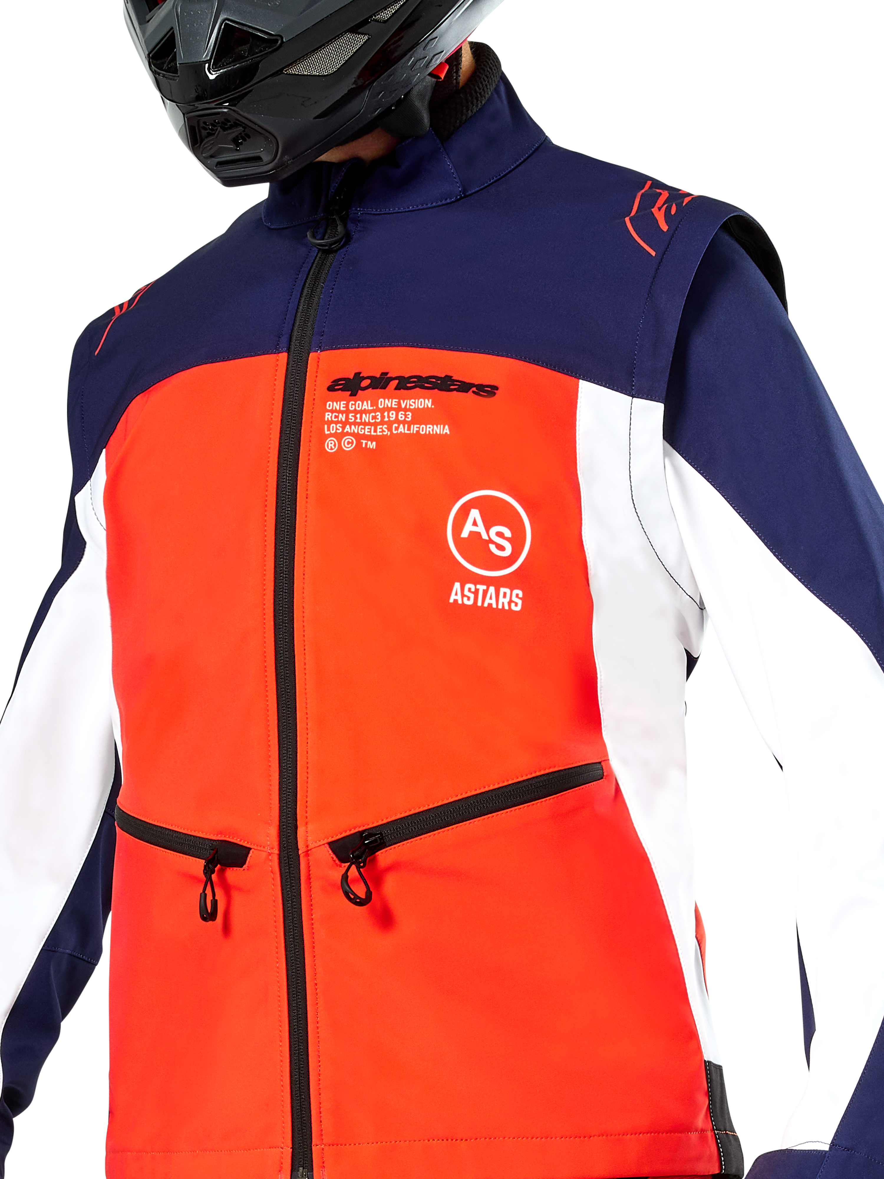 Alpinestars Lite-Dura Softshell Jacket in Navy Hot Orange and White, close-up view of the torso, featuring a bright orange front panel with white side panels and navy blue shoulders, zippered hand pockets, and prominent Alpinestars branding, worn by a rider with a black off-road helmet.
