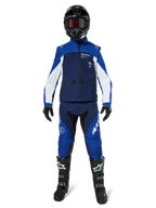 Alpinestars Lite-Dura Softshell Jacket, Off-Road Motorcycle Jacket in Navy, Bright Blue, and White, worn with a matching full gear set including a black helmet, enduro pants, and black boots, technical windproof apparel for dirt bike riding