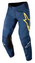 Alpinestars Techstar Phantom Pants, Motocross Racing Pants, Dark Blue with Yellow and White accents, featuring black leather knee panels, large yellow star logo on thigh, white ASTARS branding, durable stretch rip-stop fabric for off-road racing