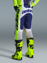 Alpinestars 2026 Racer Air Riway Pants, Motocross Pants, Light Gray Yellow Fluo and Blue, rear view showing bold blue branding on the seat, worn with matching jersey and bright yellow fluo boots, ergonomic race-fit design