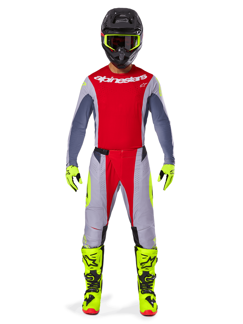 Motocross-Fahrer mit Alpinestars 2025 Techstar Melt Hose in Hellrot und Grau, mit leuchtend roten Einsätzen und neongelben Akzenten, kombiniert mit passendem Trikot, schwarzem Helm mit neongelber Brille sowie leuchtend gelben Stiefeln und Handschuhen, abgestimmtes Outfit für professionellen Motocross-Rennsport.