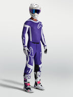 Alpinestars Supertech Vesta Pants in Deep Blue and White, professional motocross gear on-model with matching racing set.