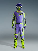 Alpinestars 2026 Racer Portl Pants and matching gear set, Motocross rider in Purple and Yellow Fluo, featuring a coordinated jersey, helmet, goggles, and bright yellow boots, designed for off-road performance.