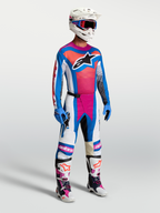 Alpinestars Techstar Maven Pants in White, Hot Coral, and Blue, shown on-model as part of a complete motocross racing gear set.