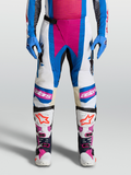 Alpinestars Techstar Maven Hose, Motocross-Hose in Weiß und Blau mit korallenfarbenen Akzenten und Leder-Knieeinsätzen.