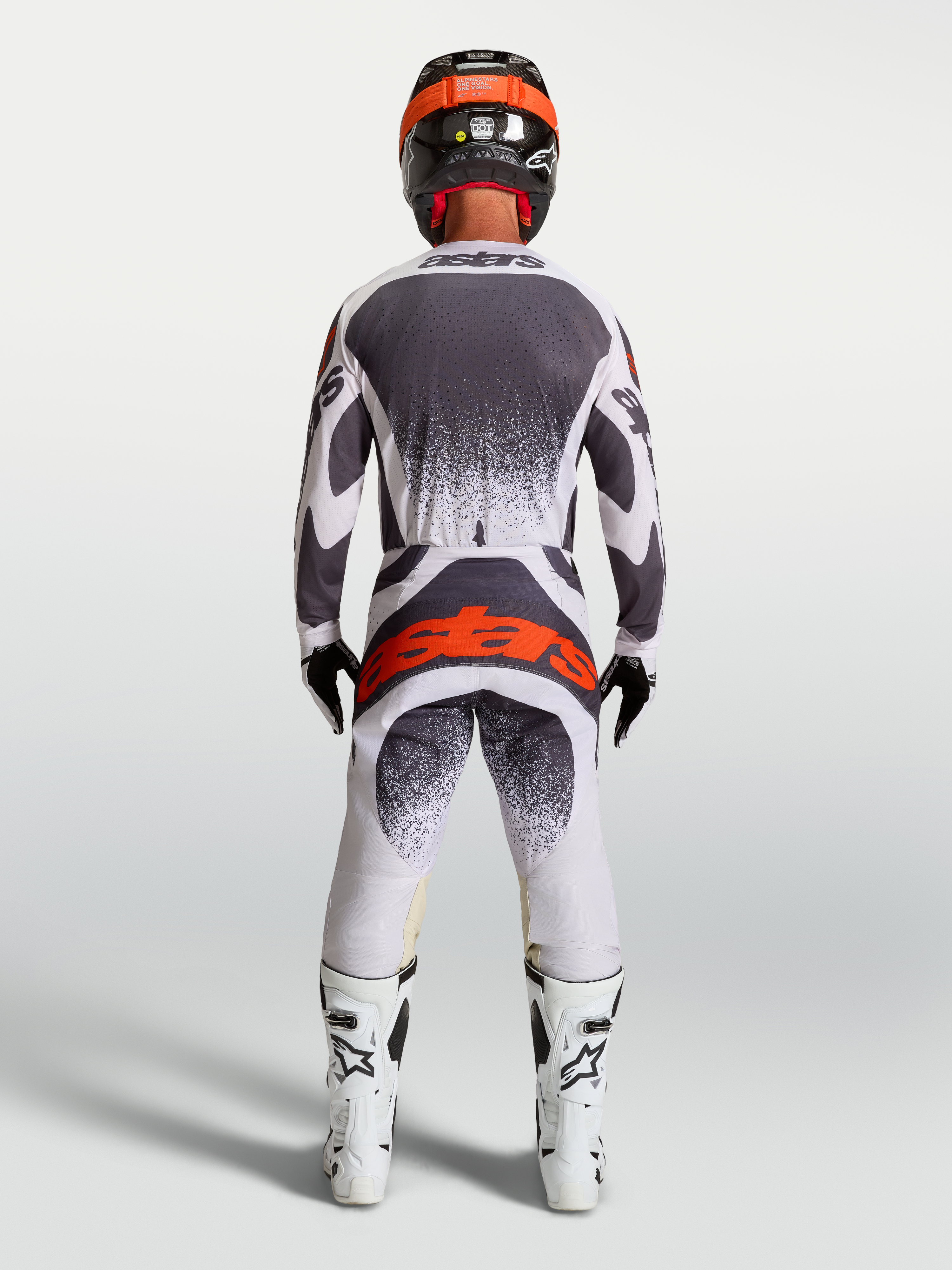 Alpinestars Techstar Swan Hose, Motocrosshose für Herren, Rückansicht in Helllila und Dunkelgrau mit fluoreszierendem Rot, ergonomischer Rennschnitt, Teil einer kompletten Motocross-Rennausrüstung.