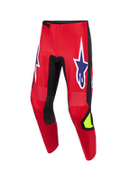 Alpinestars 2026 Fluid Grid Hose, Motocross-Hose, Rot, Schwarz und Lila, mit großen lila Stern-Logos mit weißer Umrandung an den Oberschenkeln, schwarzen Stretch-Einsätzen an den Beininnenseiten, neongelbem Akzent am Schienbein, strapazierfähige Poly-Gewebe-Konstruktion für Offroad-Fahrten