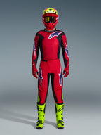 Alpinestars 2026 Fluid Grid Gear Set, Motocross Outfit, Red and Black, complete riding gear with red jersey and pants featuring blue and white logos, matching red helmet with neon yellow accents, and neon yellow boots, high-performance design for off-road racing