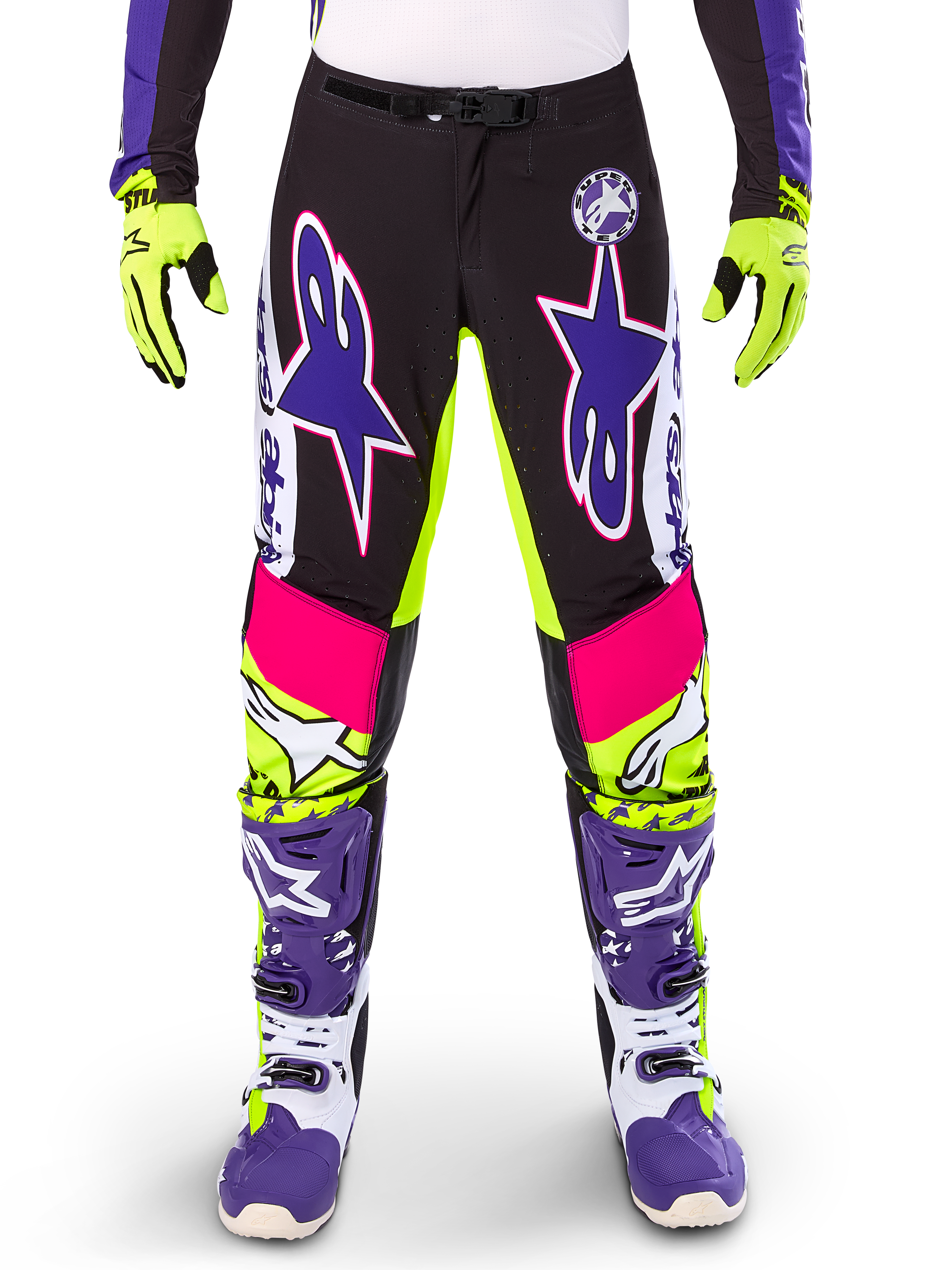 Alpinestars Limited Edition Supertech Dirt Studios Pants, Motocross Pants, White Purple and Yellow Fluo, featuring black panels with neon yellow and pink accents, large purple star logos, shown with matching neon yellow gloves and purple racing boots, durable off-road racing apparel
