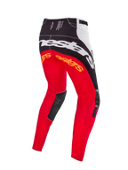 Alpinestars Limited Edition Techstar Deep Motocross-Hose, Farbkombination Schwarz Weiß High Red, Rückansicht mit großem weißem Alpinestars-Branding auf dem Gesäß, orangefarbenen Logos an den Oberschenkeln und schwarzen Leder-Innenkniepaneelen, entwickelt für den professionellen Offroad-Rennsport