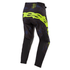 Alpinestars 2024 Techstar Rantera Hose, Motocross-Hose, Schwarz, Navy und Gelb Fluo, Rückansicht mit auffälligem Branding in Gelb Fluo auf dem Gesäß, navyfarben gemusterte Einsätze und technisches schwarzes Gewebe für Offroad-Rennperformance