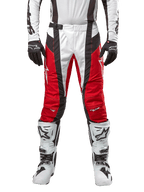 Alpinestars 2024 Techstar Ocuri Pants, Motocross Pants, Mars Red White and Black, front view worn with matching white jersey, black gloves and white boots, featuring breathable perforated panels and a racing-inspired cut for off-road performance.