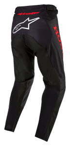 Honda Racer Iconic Hose, Motocross-Hose, Schwarz und Rot, Rückansicht mit weißem Alpinestars-Logo auf dem Gesäß und rotem Honda-Branding an der Seite, ergonomisches Design mit rotem Logo am Taillenbund für den Offroad-Rennsport.