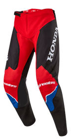 Alpinestars Honda Racer Iconic Hose, Motocross-Hose, Hellrot, Schwarz und Weiß mit blauen Akzenten, großes weißes HONDA-Logo auf dem Oberschenkel, Alpinestars-Branding an den Knien, ergonomisch vorgeformte Beinkonstruktion, verstellbarer Ratschenverschluss an der Taille.