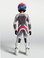 Alpinestars Youth Supertech Swan Pants, gray and red fluo youth motocross racing gear shown from the rear.