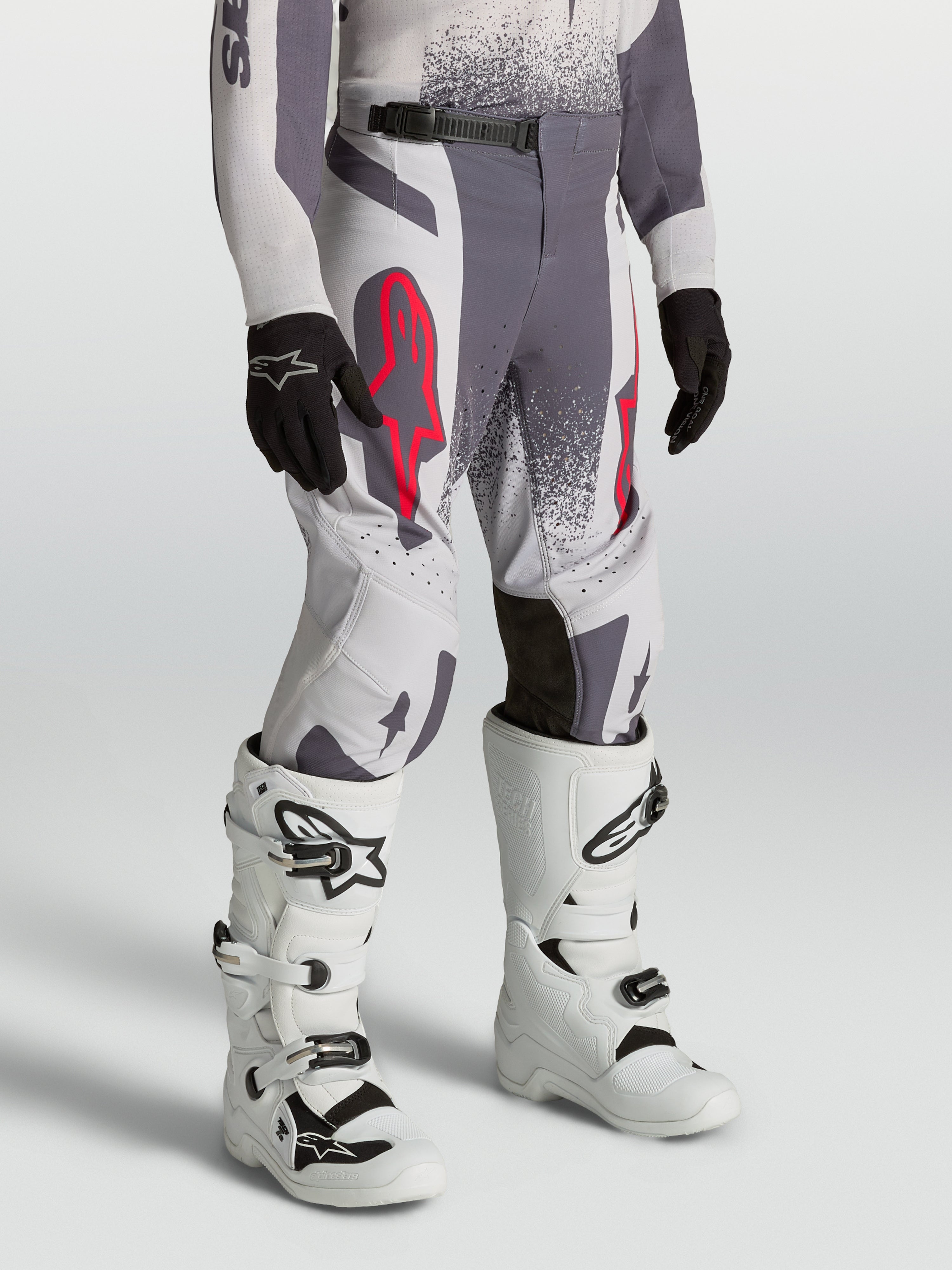 Alpinestars Youth Supertech Swan Pants, gray and light lilac athletic fit motocross racing pants with red fluo accents.