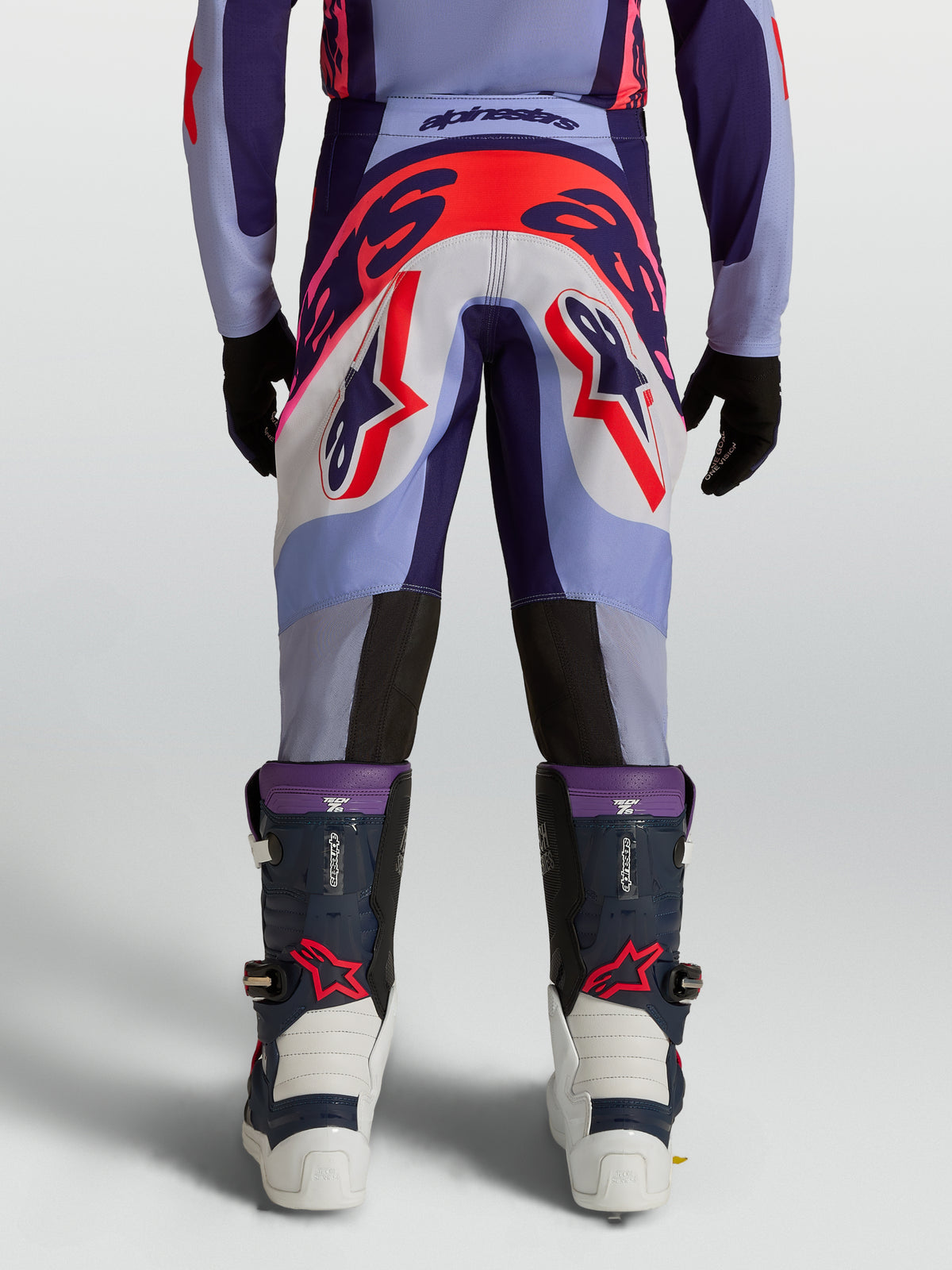 Alpinestars Youth Supertech Dyna Pants, purple and pink fluo motocross pants with athletic fit, rear on-model view.
