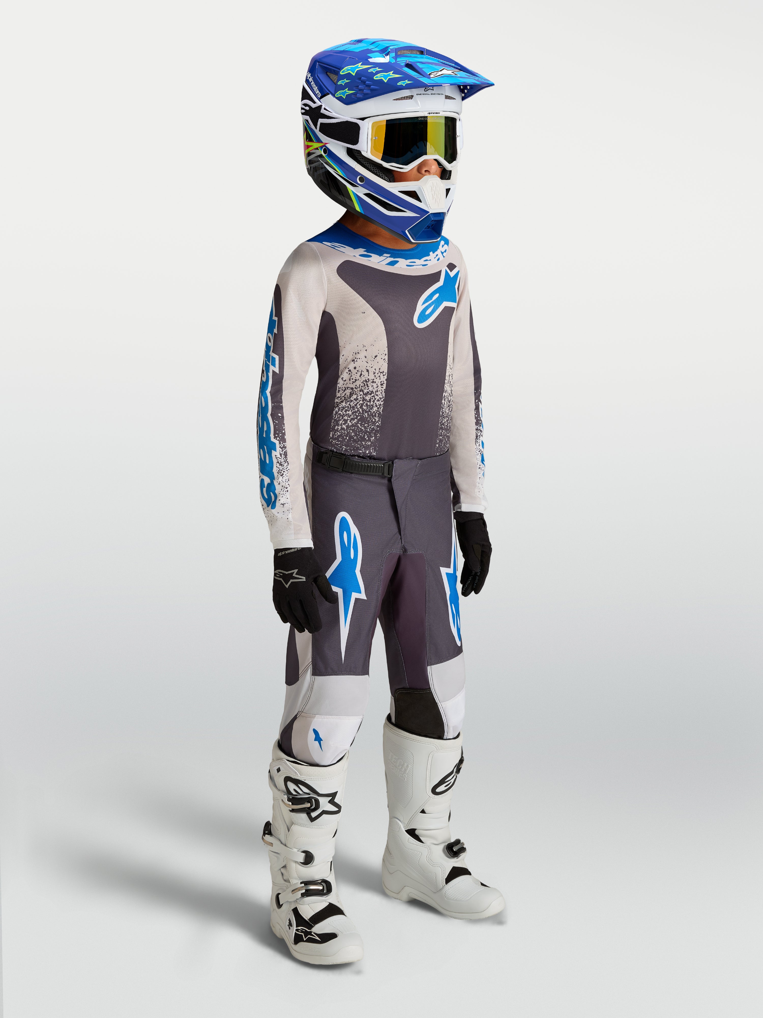 Alpinestars Fluid Drag Jugend-Hose 2027, Motocross-Hose in Grau und Blau aus strapazierfähigem 600D-Polygewebe für Offroad-Einsätze.
