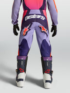 Alpinestars Youth Fluid Hunt Pants, purple and pink motocross racing gear with star logos and durable textile construction.