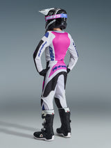 Alpinestars 2026 Youth Fluid Grid Pants, Motocross Pants, Black Light Gray and Purple, rear view of youth rider wearing full matching racing gear including jersey, helmet, and boots, coordinated outfit for off-road racing