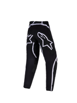 Alpinestars 2026 Jugend Fluid Apex Hose, Motocross-Hose, Schwarz und Weiß, Rückansicht mit großen weißen Stern-Logos auf dem Gesäß und geschwungenen grafischen Akzenten, technische Offroad-Ausrüstung für Jugendliche