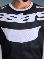 Alpinestars 2026 Racer Air Riway Jersey, Motocross Jersey, Black and White, close-up view of chest with large white logo, detailed mesh airflow fabric texture, technical breathable gear for off-road riding