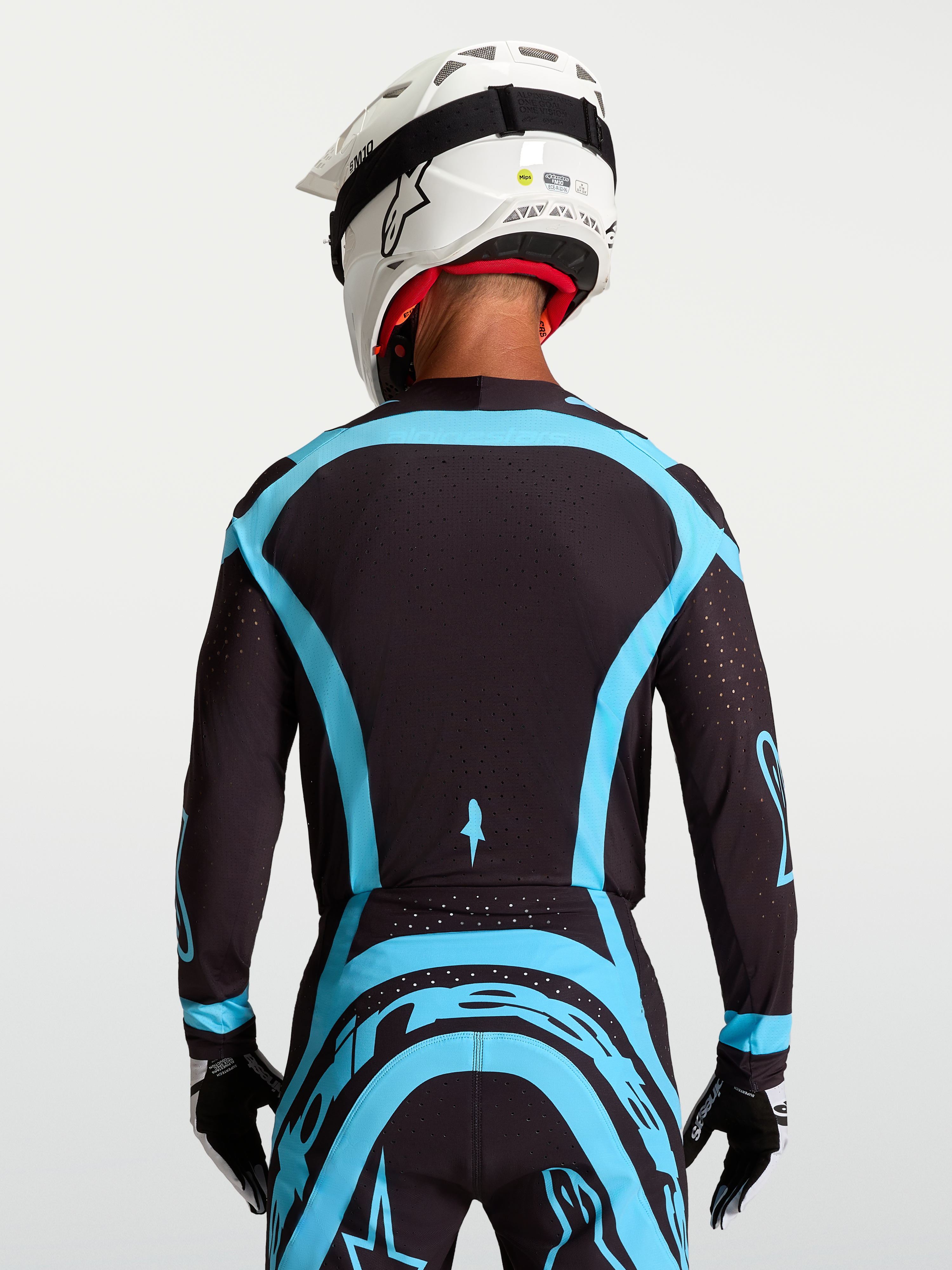 Alpinestars Supertech Vesta Trikot, Pro-Level Motocross-Jersey in Schwarz und Türkis mit atmungsaktivem Stretch-Mesh.