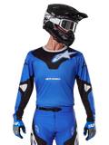 2025 Racer Veil Jersey, Motocross Racing Jersey, Blue and Black, worn with matching motocross gear including helmet and gloves, sporty design with white Alpinestars branding