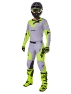 Alpinestars 2025 Racer Veil Gear Set, complete motocross outfit, Gray and Neon Yellow Fluo, featuring jersey, pants, helmet, goggles, gloves, and boots with black accents, professional racing gear for off-road performance.