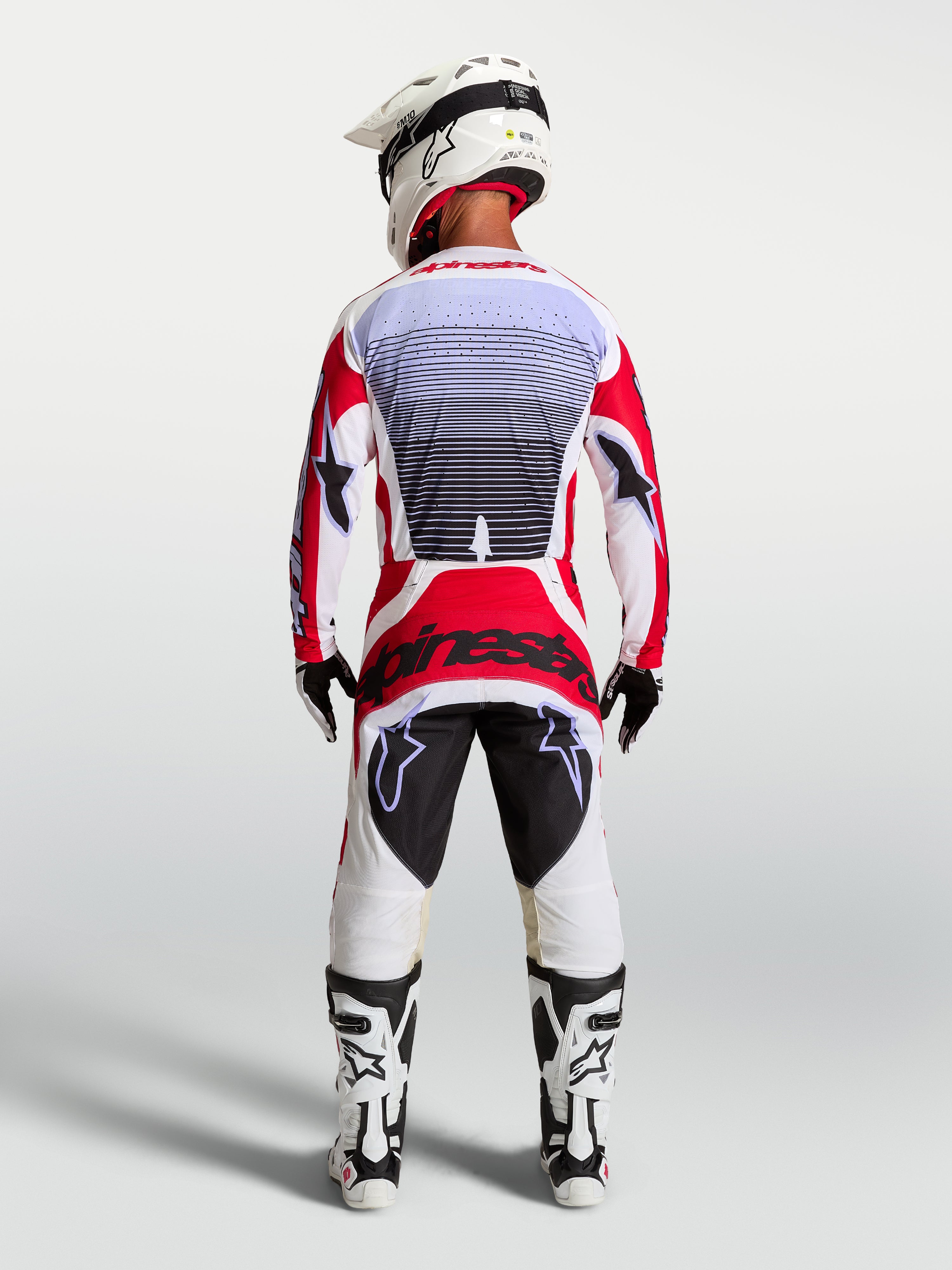 Alpinestars Techstar Maven Motocross-Set, Herren-Renntrikot und -Hose, Feuerrot und Weiß, Rückansicht, athletische Passform.