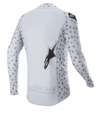 Alpinestars 2023 Supertech North Jersey, Motocross-Trikot, Haze Gray und Schwarz, Rückansicht mit abstraktem Punktmuster an Ärmeln und Seiten, großem Stern-Logo, verlängertem Rückenteil und atmungsaktiver Performance-Konstruktion
