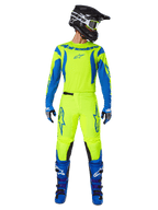 Alpinestars 2025 Fluid Haul Gear Set, Motocross Jersey and Pants, Yellow Fluo and Blue, worn with matching blue boots and a black helmet, featuring bold Astars logos and an athletic ergonomic cut for off-road racing.