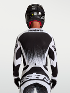 Alpinestars Techstar Swan Motocross-Trikot für Herren, Schwarz und Weiß, Rückansicht mit athletischer Rennpassform.